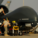 U.S. Air Force maintainers from the 308th Expeditionary Aircraft Maintenance Squadron prepare an RQ-4A Global Hawk for takeoff at an undisclosed location in Southwest Asia, Dec. 2, 2010.